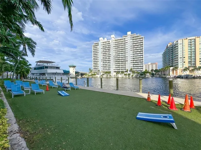 a view of roof deck with lake view and mountain view