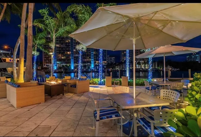 a view of a patio with chairs and a table