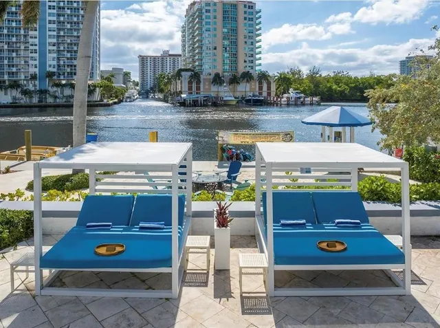 a view of swimming pool with outdoor seating