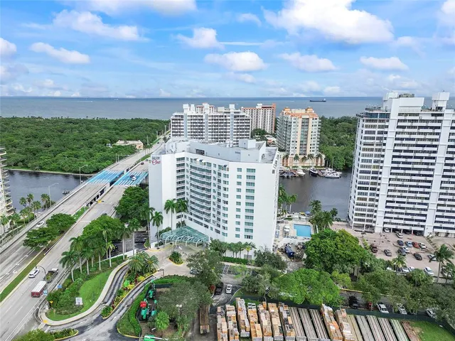 a kitchen with cabinets appliances a sink and a window