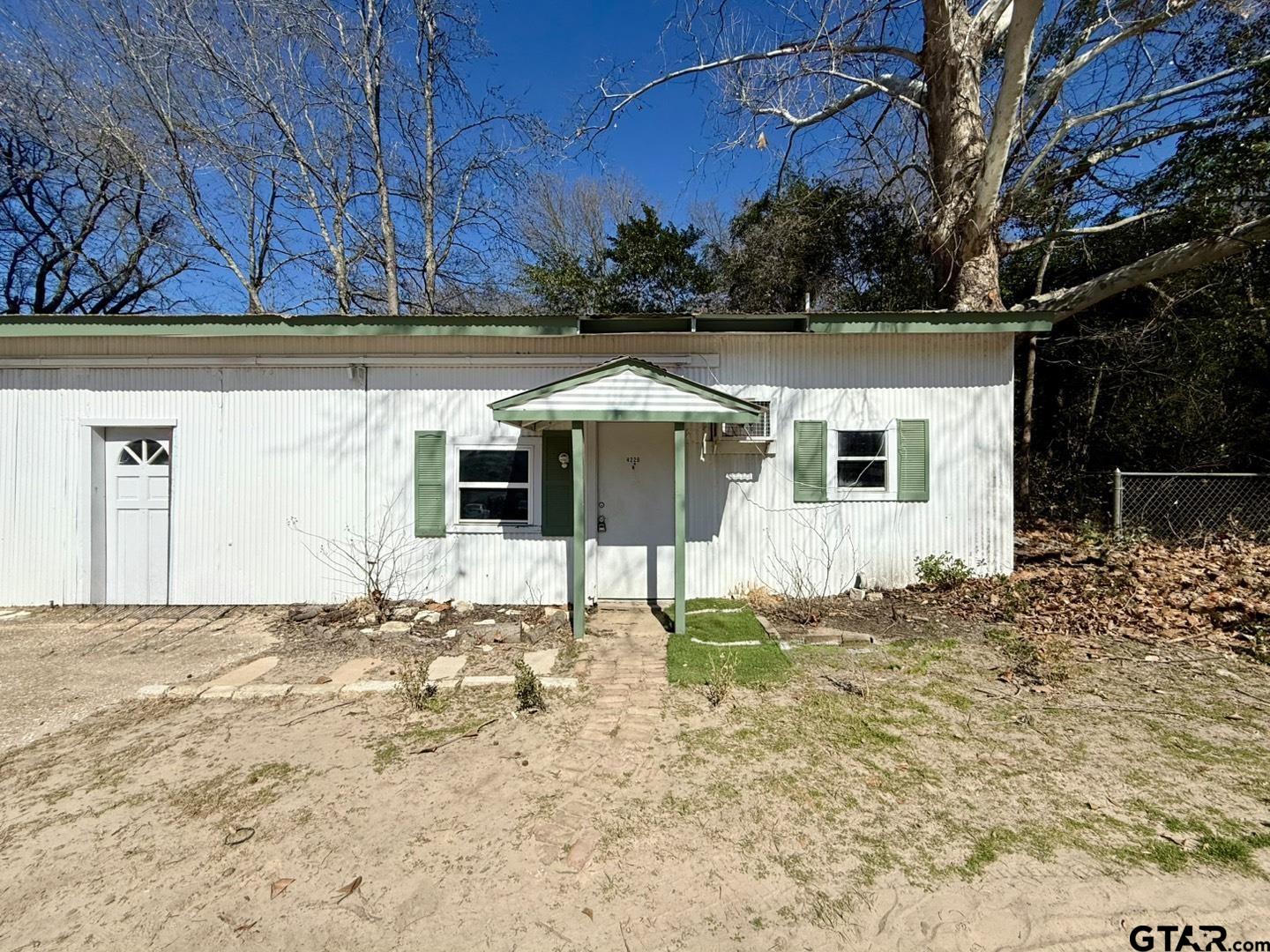 4229 Old Chandler Road, Unit B Tyler, TX 75702 - Photo 15 of 17 a view of a house with a yard