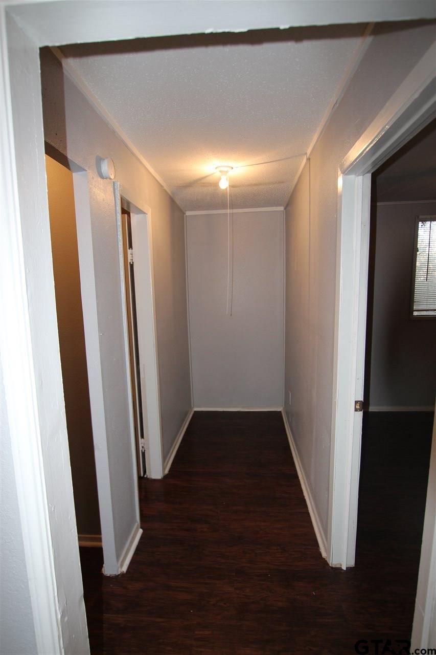 4229 Old Chandler Road, Unit B Tyler, TX 75702 - Photo 8 of 17 a view of hallway with wooden floor