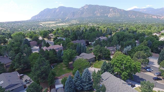 3123 Springdowns Place Colorado Springs, CO 80906 - Photo 3 of 36 Close to the Mountains and Broadmoor. Large level lot wrap around this home.