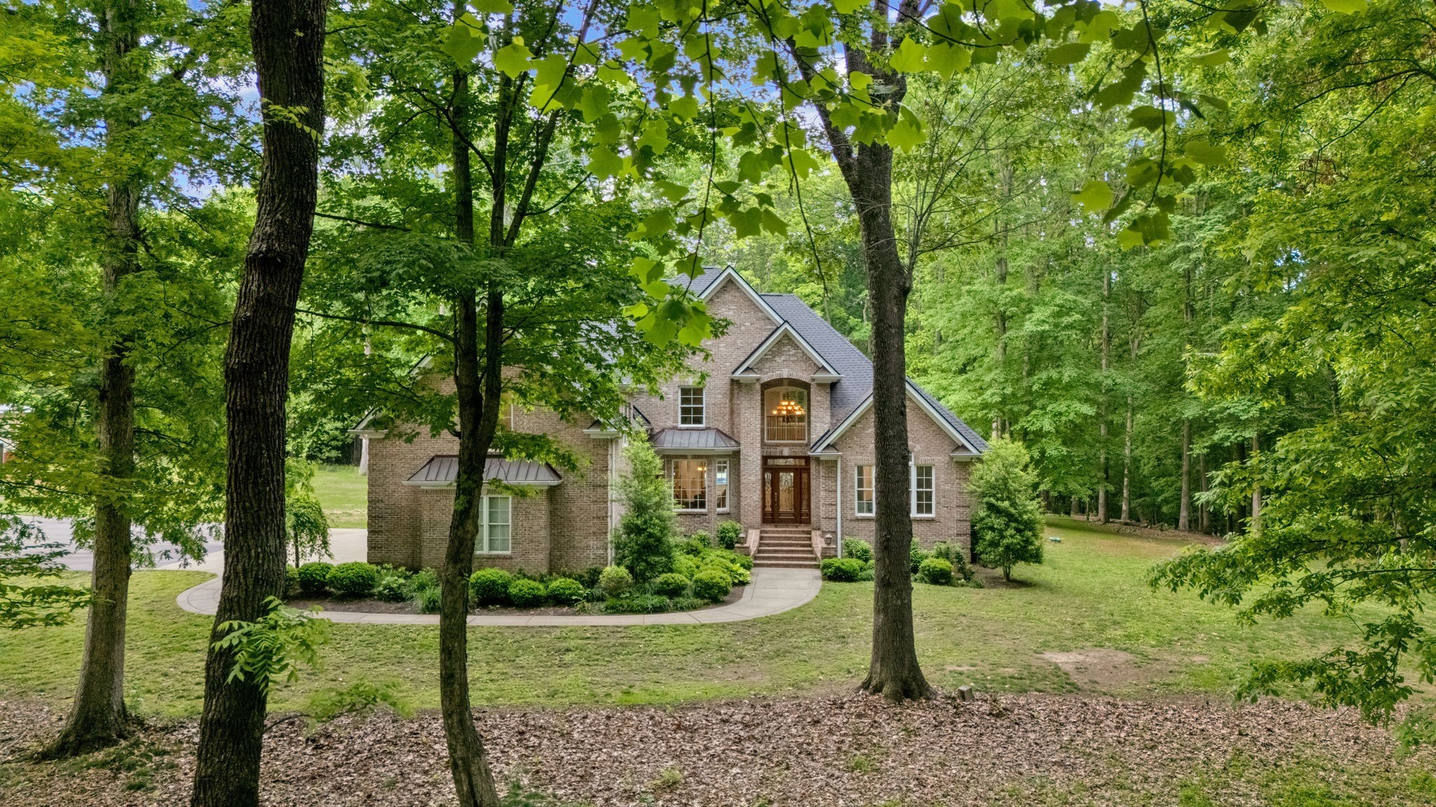6948 Whispering Oaks Drive Springfield, TN 37172 - Photo 16 of 16 a front view of a house with a yard