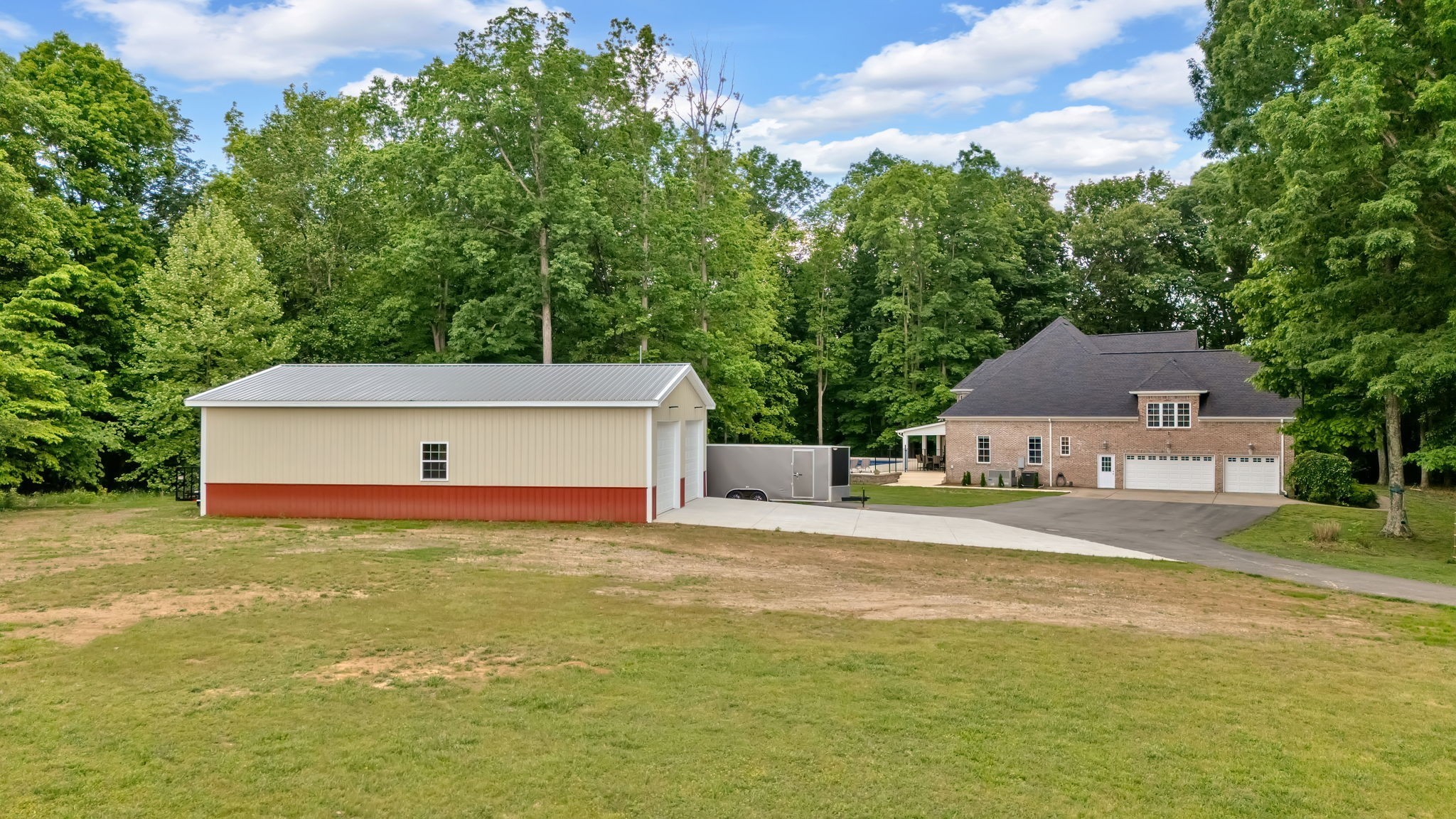 6948 Whispering Oaks Drive Springfield, TN 37172 - Photo 3 of 16 a front view of a house with a yard and a garage