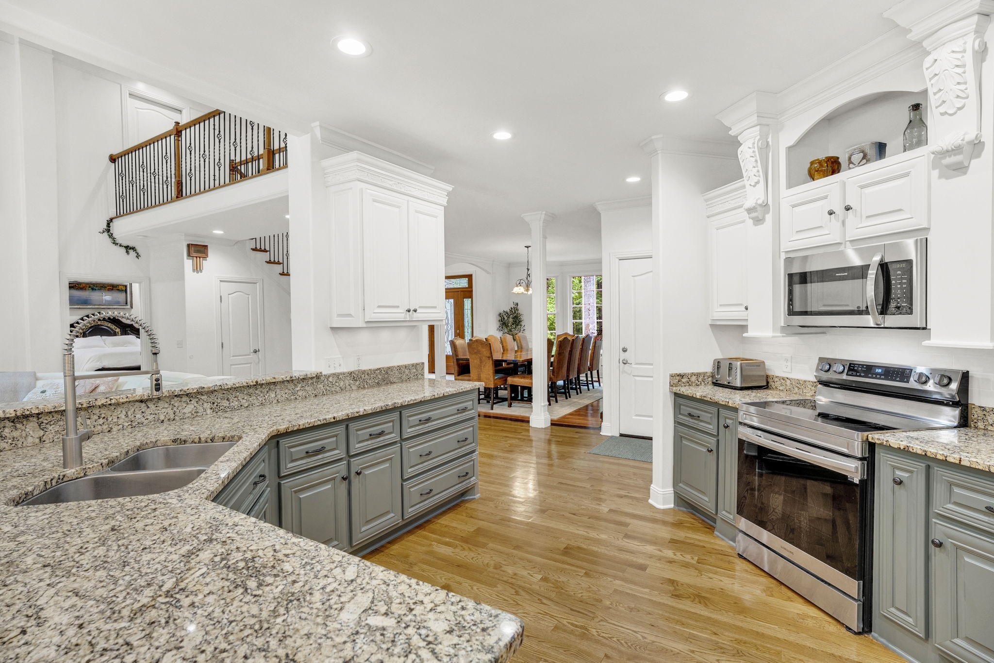 6948 Whispering Oaks Drive Springfield, TN 37172 - Photo 7 of 16 a large kitchen with stainless steel appliances granite countertop a stove and a sink
