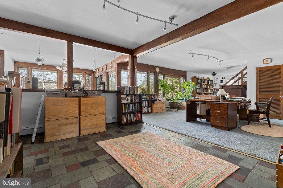 1112 General Saint Claire Road Washington Crossing, PA 18977 - Photo 12 of 34 a room with lots of wooden furniture and a view of living room