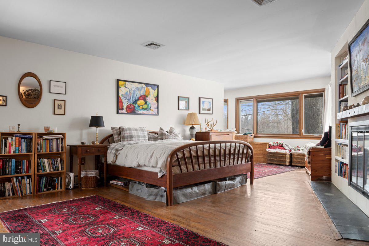 1112 General Saint Claire Road Washington Crossing, PA 18977 - Photo 15 of 34 a bed room with a bed and a book shelf