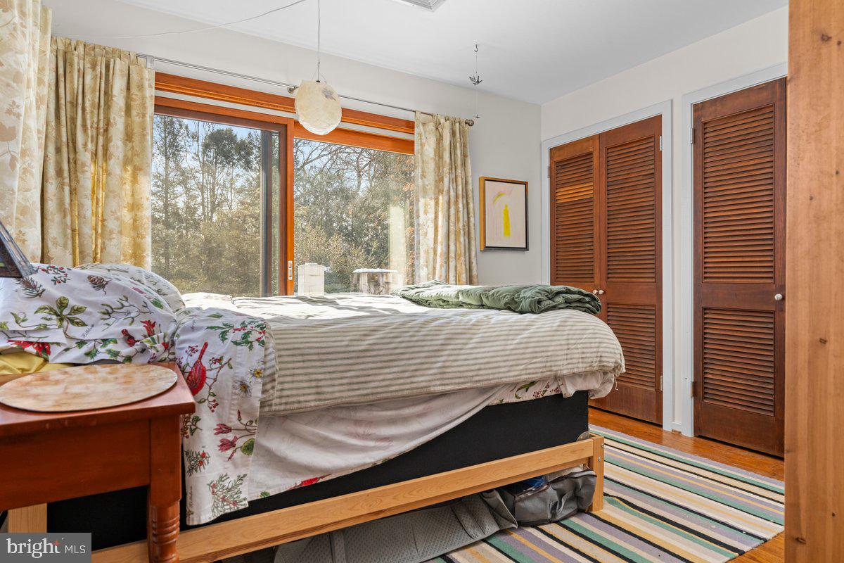 1112 General Saint Claire Road Washington Crossing, PA 18977 - Photo 24 of 34 a bed sitting in a bedroom next to a window