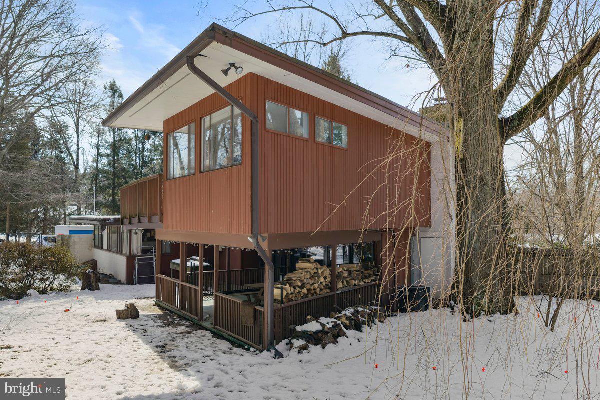 1112 General Saint Claire Road Washington Crossing, PA 18977 - Photo 3 of 34 a front view of a house with a yard