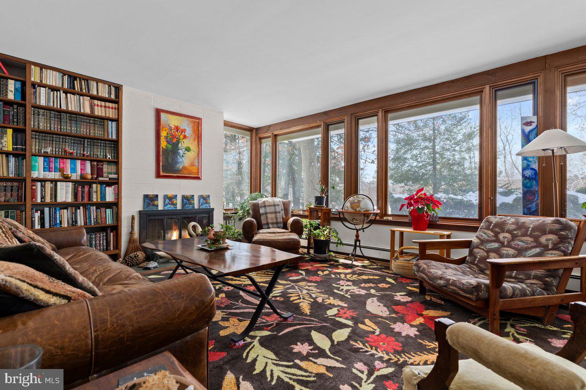 1112 General Saint Claire Road Washington Crossing, PA 18977 - Photo 7 of 34 a living room with furniture a rug and a large window