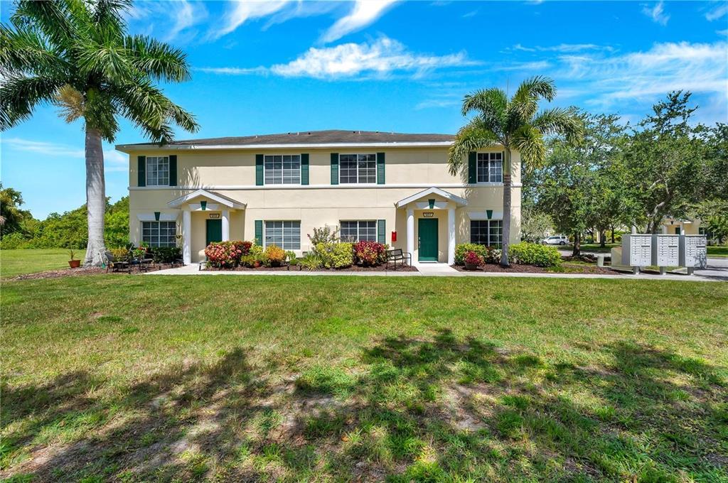 280 Cape Harbour Loop, Unit 101 Bradenton, FL 34212 - Photo 2 of 35 a front view of house with yard and green space