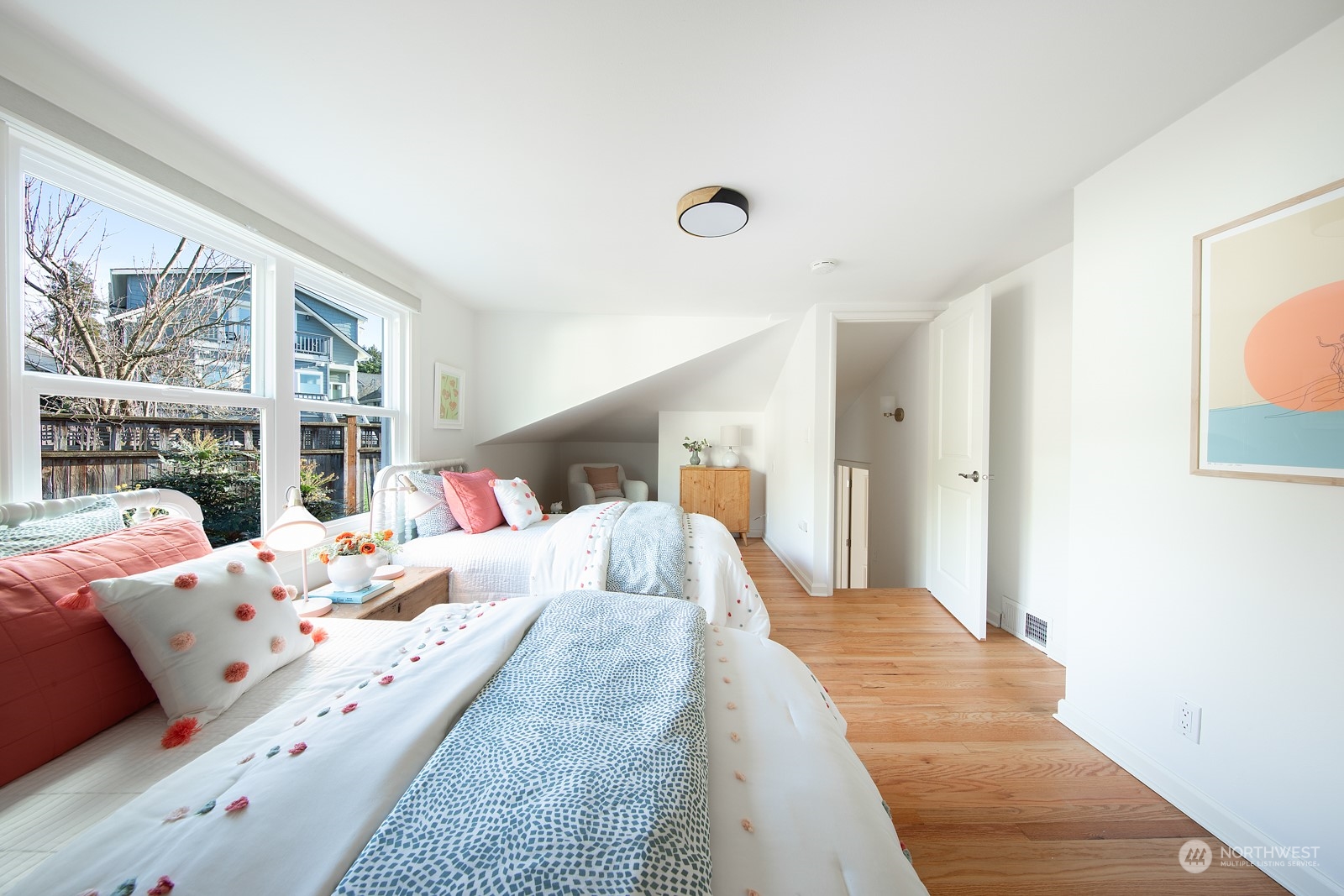 1821 North 80th Street Seattle, WA 98103 - Photo 12 of 30 a bedroom with a large bed and a large window