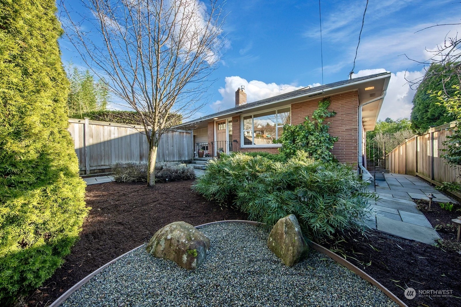 1821 North 80th Street Seattle, WA 98103 - Photo 20 of 30 a front view of a house with garden