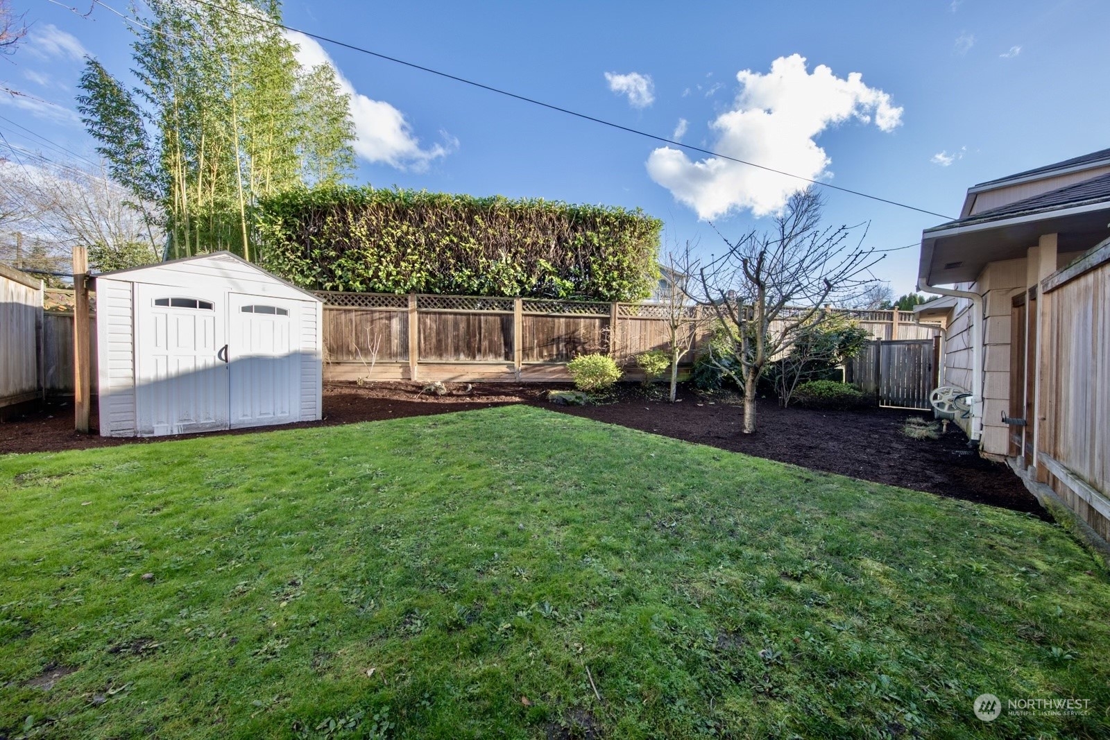 1821 North 80th Street Seattle, WA 98103 - Photo 24 of 30 a view of a house with a backyard