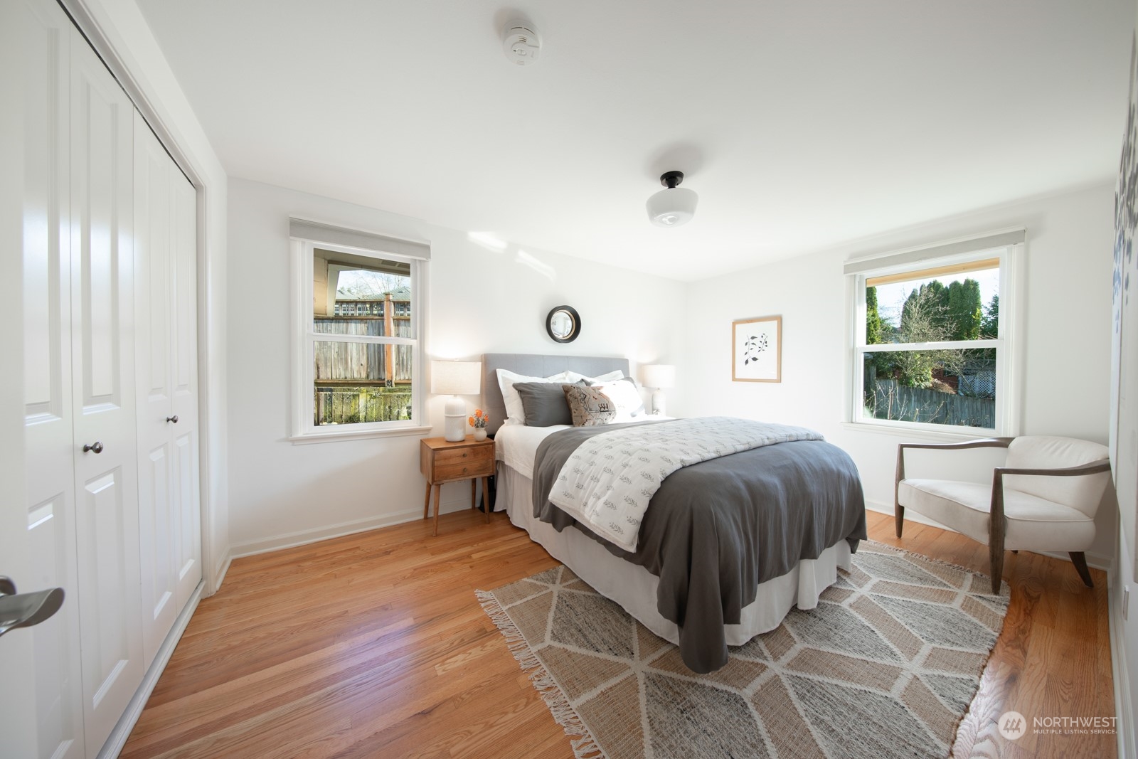 1821 North 80th Street Seattle, WA 98103 - Photo 9 of 30 a spacious bedroom with a large bed and a window