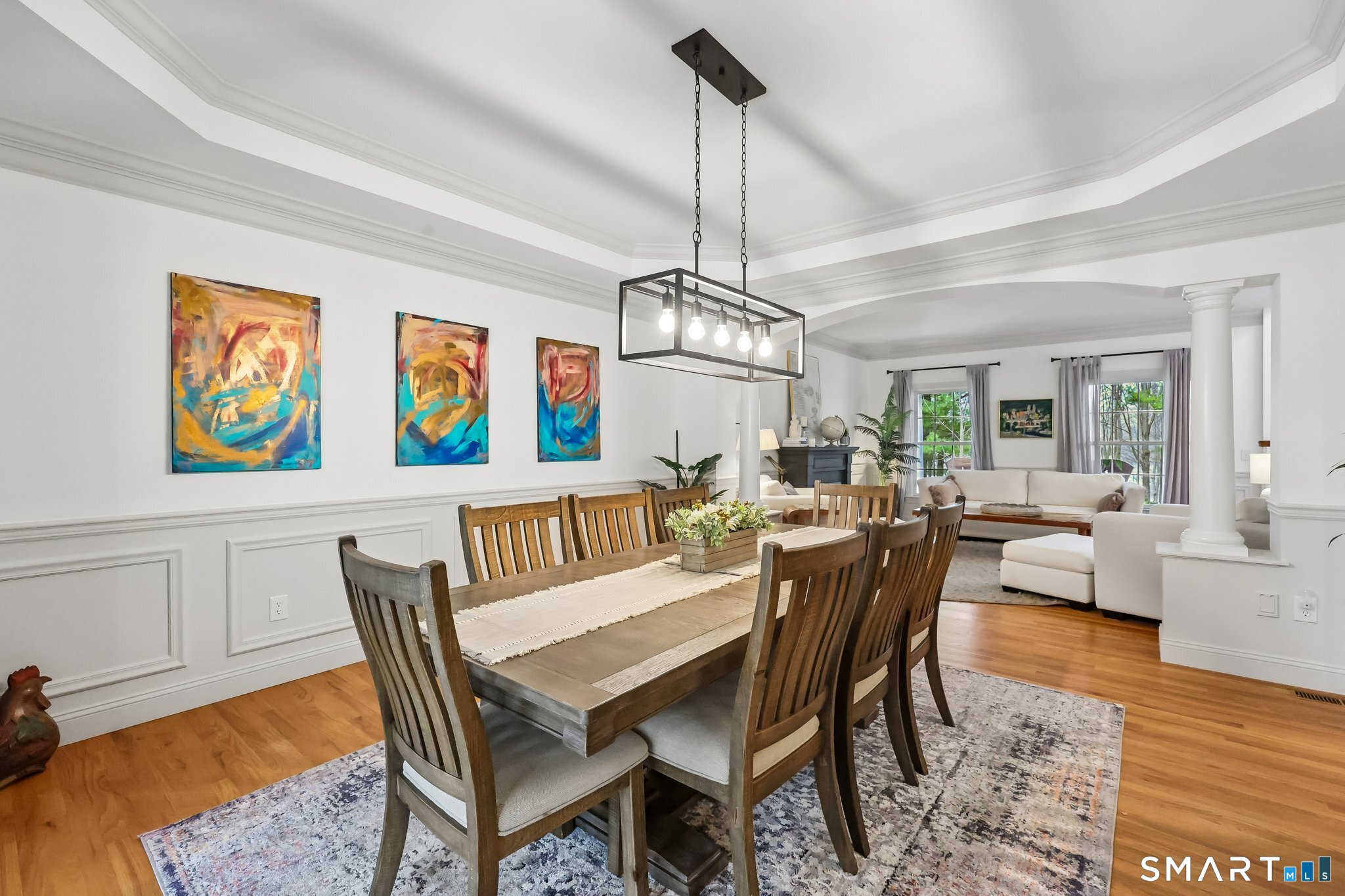 3 East Lake Road Danbury, CT 06811 - Photo 10 of 37 The formal dining room is elevated by a striking tray ceiling, adding architectural depth and sophistication to an elegant space perfect for memorable gatherings.