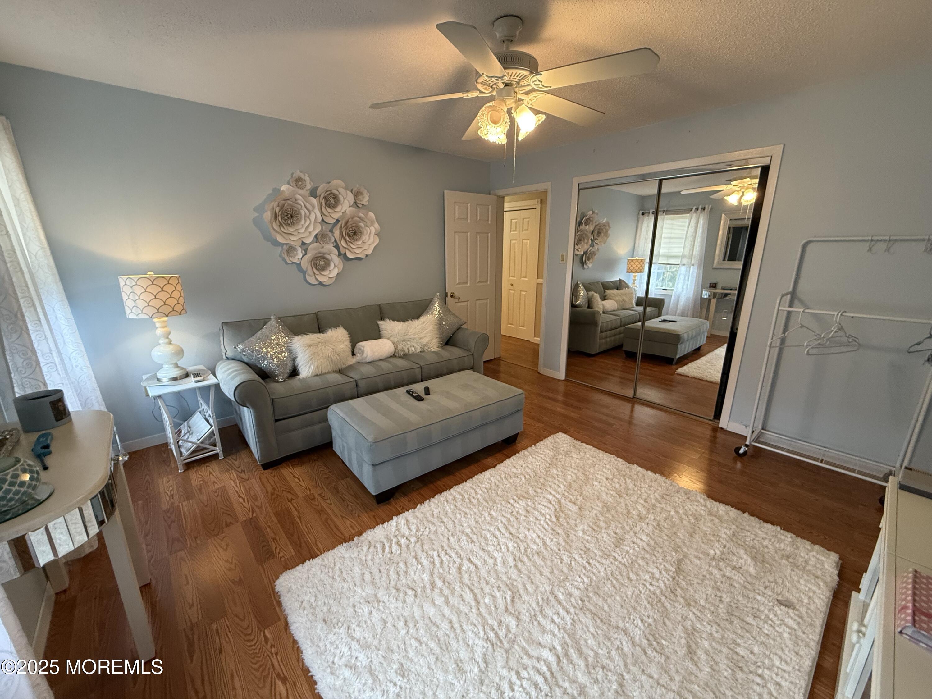 4 Hemlock Hill Road Jackson, NJ 08527 - Photo 16 of 42 a bedroom with a large bed and a chandelier