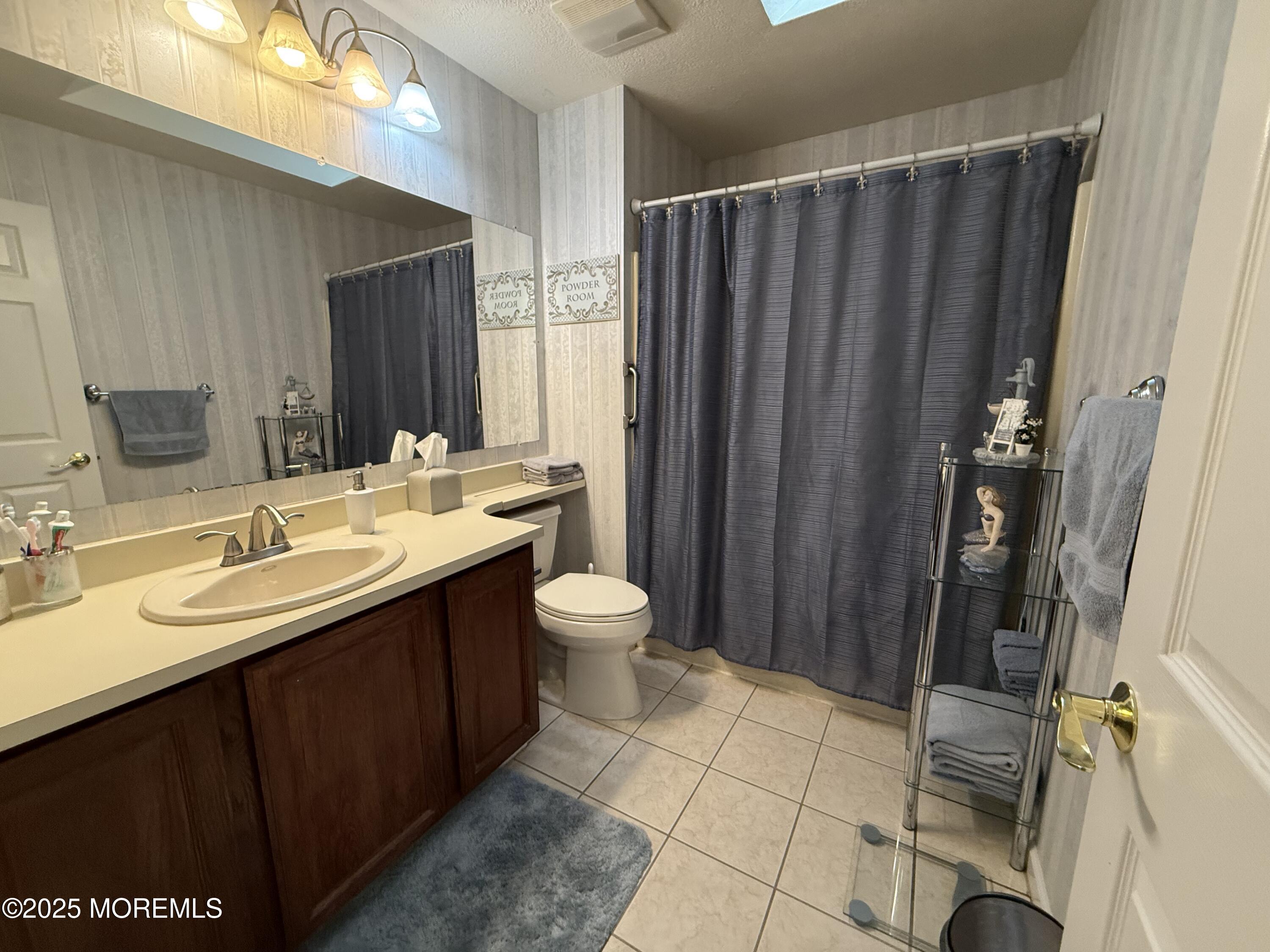 4 Hemlock Hill Road Jackson, NJ 08527 - Photo 26 of 42 a bathroom with a double vanity sink toilet and shower