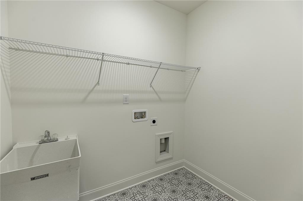 1210 Austin Road Winder, GA 30680 - Photo 32 of 56 a view of a room with racks on the wall