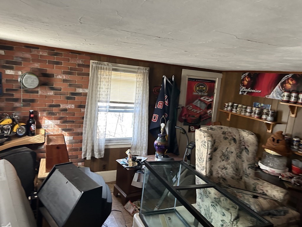 39 Platts Road Ashburnham, MA 01430 - Photo 11 of 17 a living room with furniture and a flat screen tv