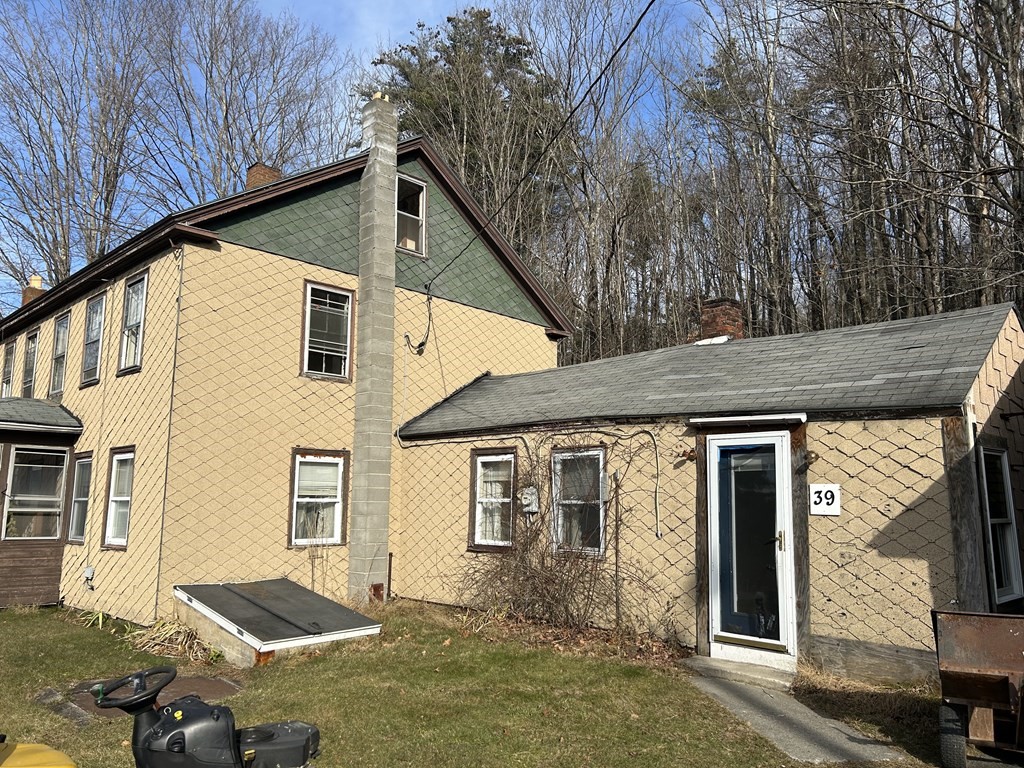 39 Platts Road Ashburnham, MA 01430 - Photo 2 of 17 a front view of a house with yard