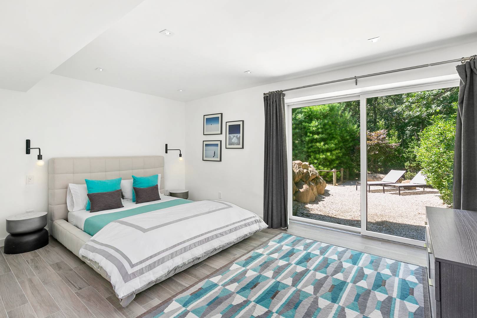 165 2 Holes Water Road East Hampton, NY 11937 - Photo 13 of 19 a bedroom with a bed and a large window