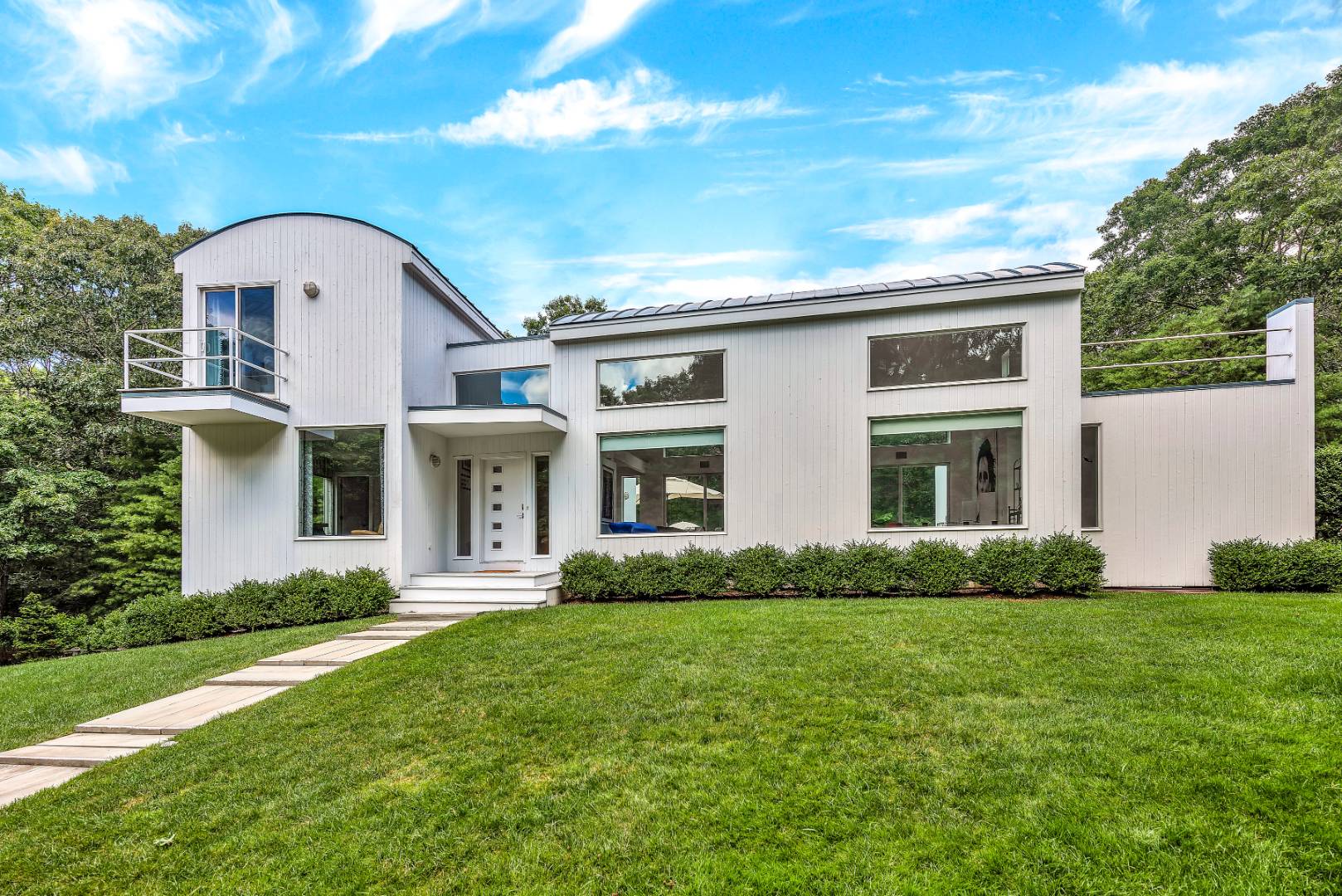 165 2 Holes Water Road East Hampton, NY 11937 - Photo 19 of 19 a front view of a house with garden