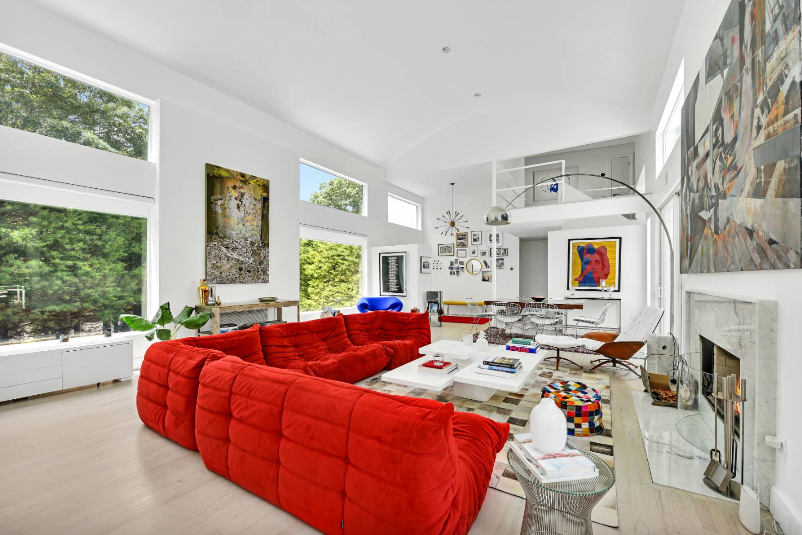 165 2 Holes Water Road East Hampton, NY 11937 - Photo 4 of 19 a living room with fireplace furniture and a large window