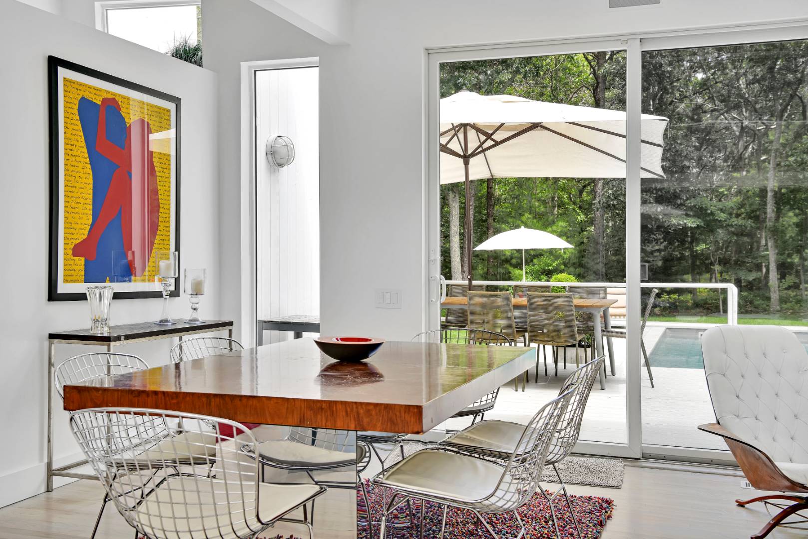 165 2 Holes Water Road East Hampton, NY 11937 - Photo 5 of 19 a view of a dining room with furniture wooden floor and a large window