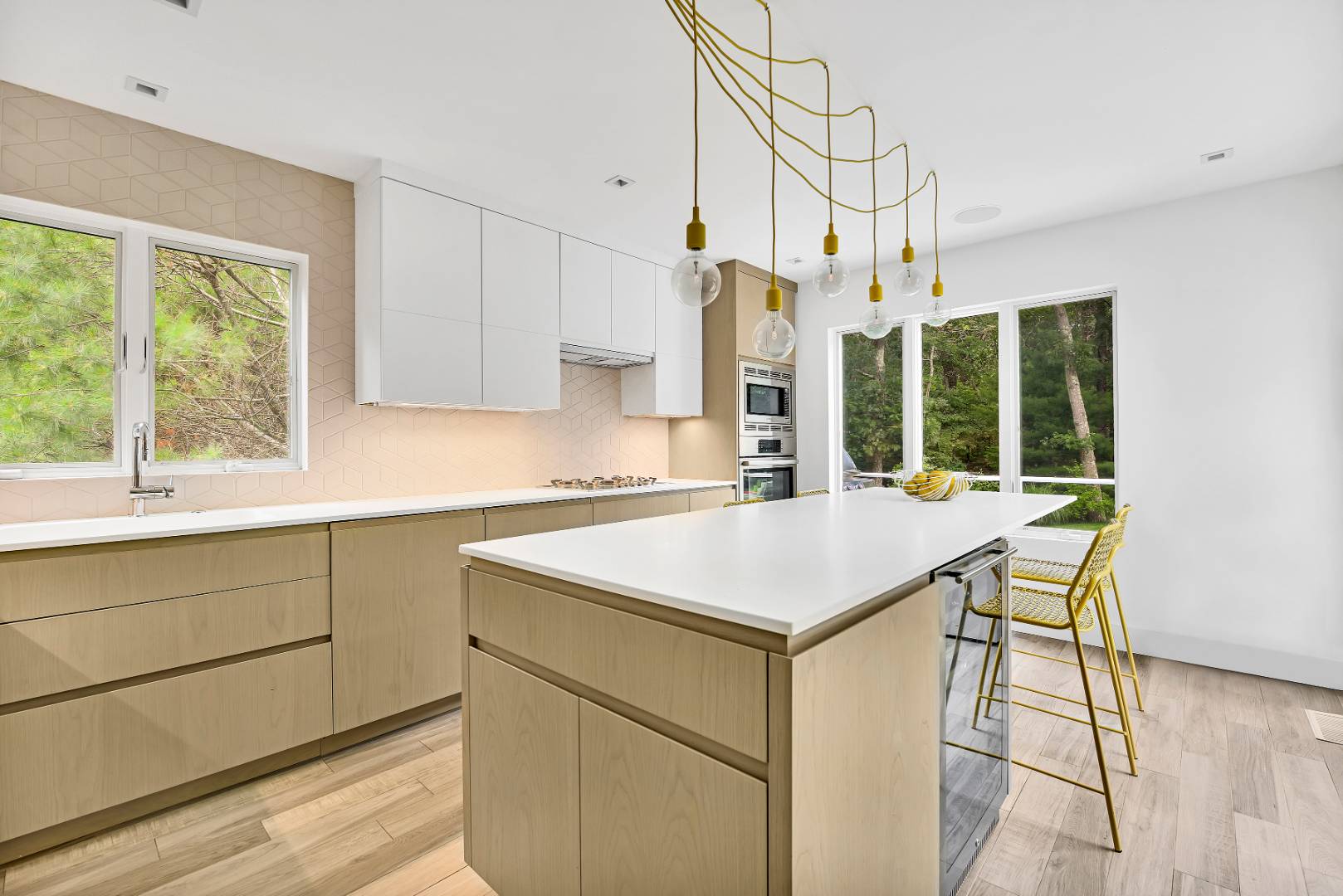 165 2 Holes Water Road East Hampton, NY 11937 - Photo 6 of 19 a kitchen with a table chairs and a window
