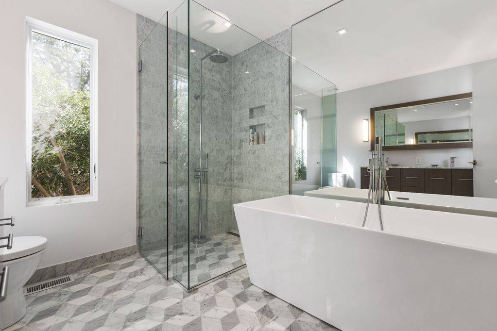 165 2 Holes Water Road East Hampton, NY 11937 - Photo 8 of 19 a bath tub sitting next to a bathroom