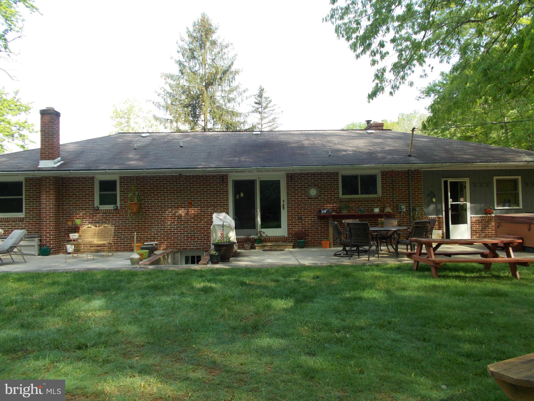 2419 Stoneybrook Road Fallston, MD 21047 - Photo 23 of 30 a front view of house with outdoor seating and yard