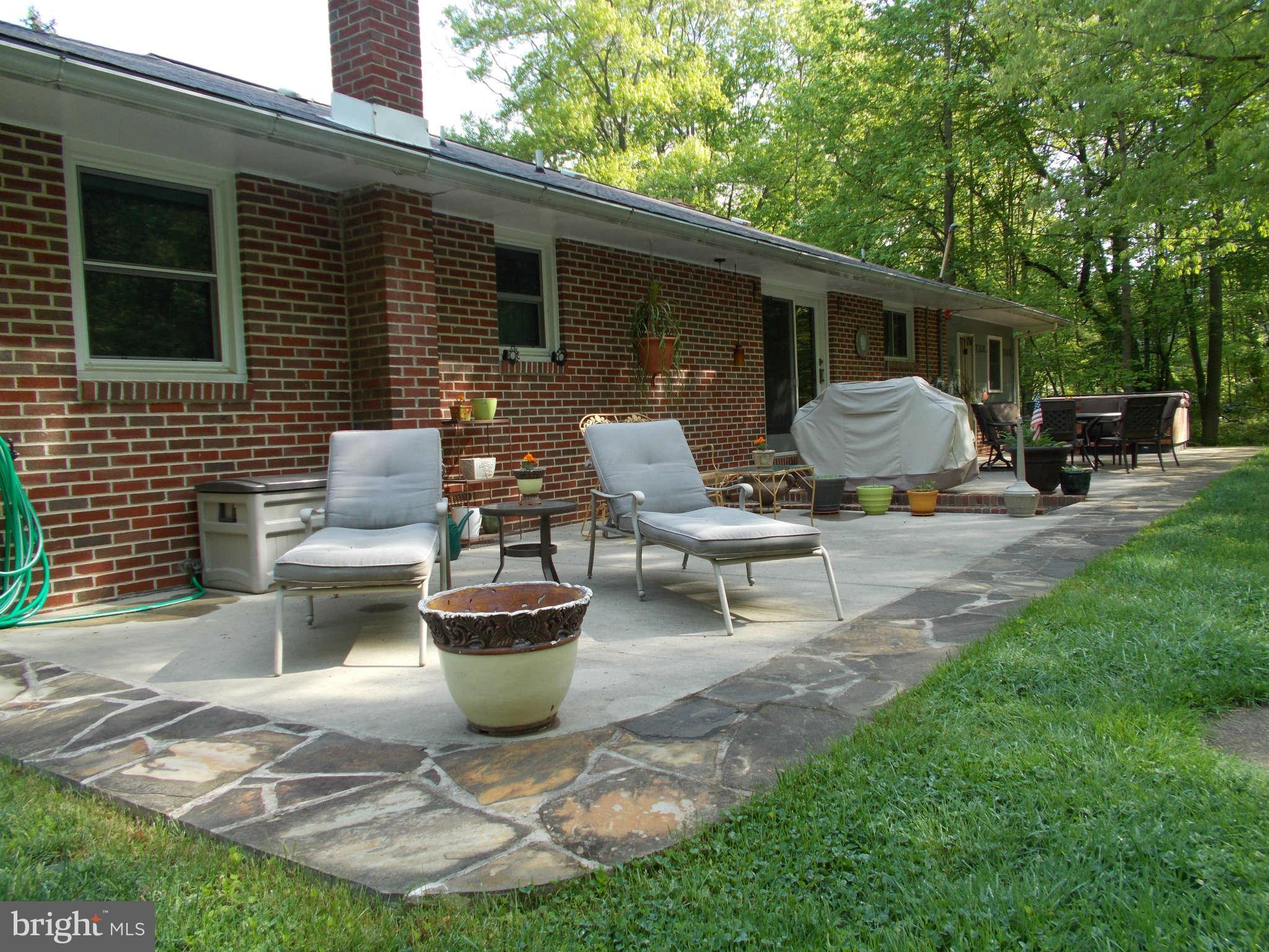2419 Stoneybrook Road Fallston, MD 21047 - Photo 26 of 30 a view of a patio with table and chairs and a barbeque