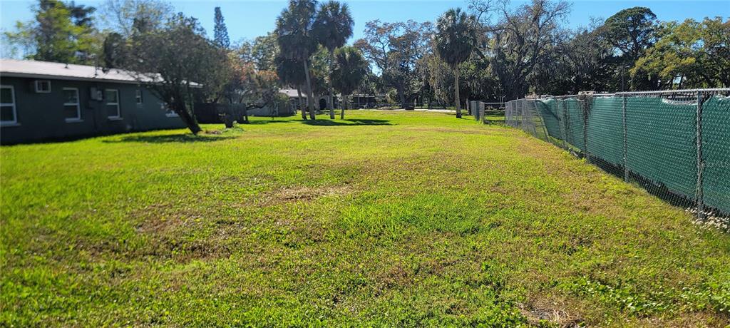 14101 Plum Lane Hudson, FL 34667 - Photo 1 of 2 a view of a swimming pool with a yard