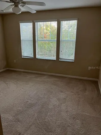 a large kitchen with cabinets and stainless steel appliances