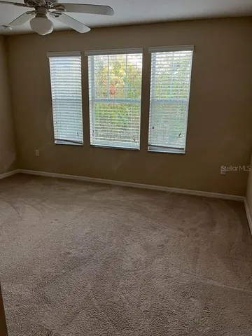 a large kitchen with cabinets and stainless steel appliances