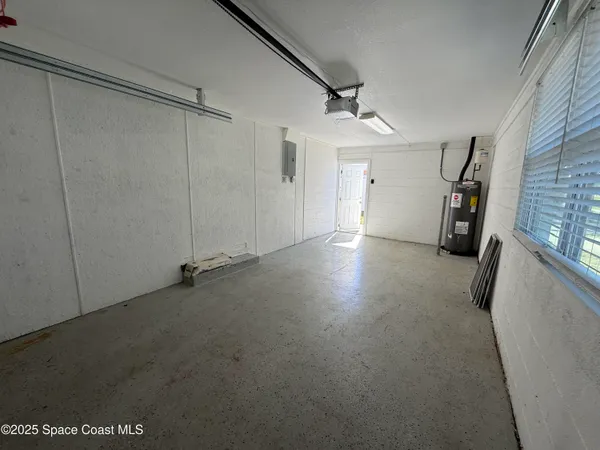 a view of empty room with windows