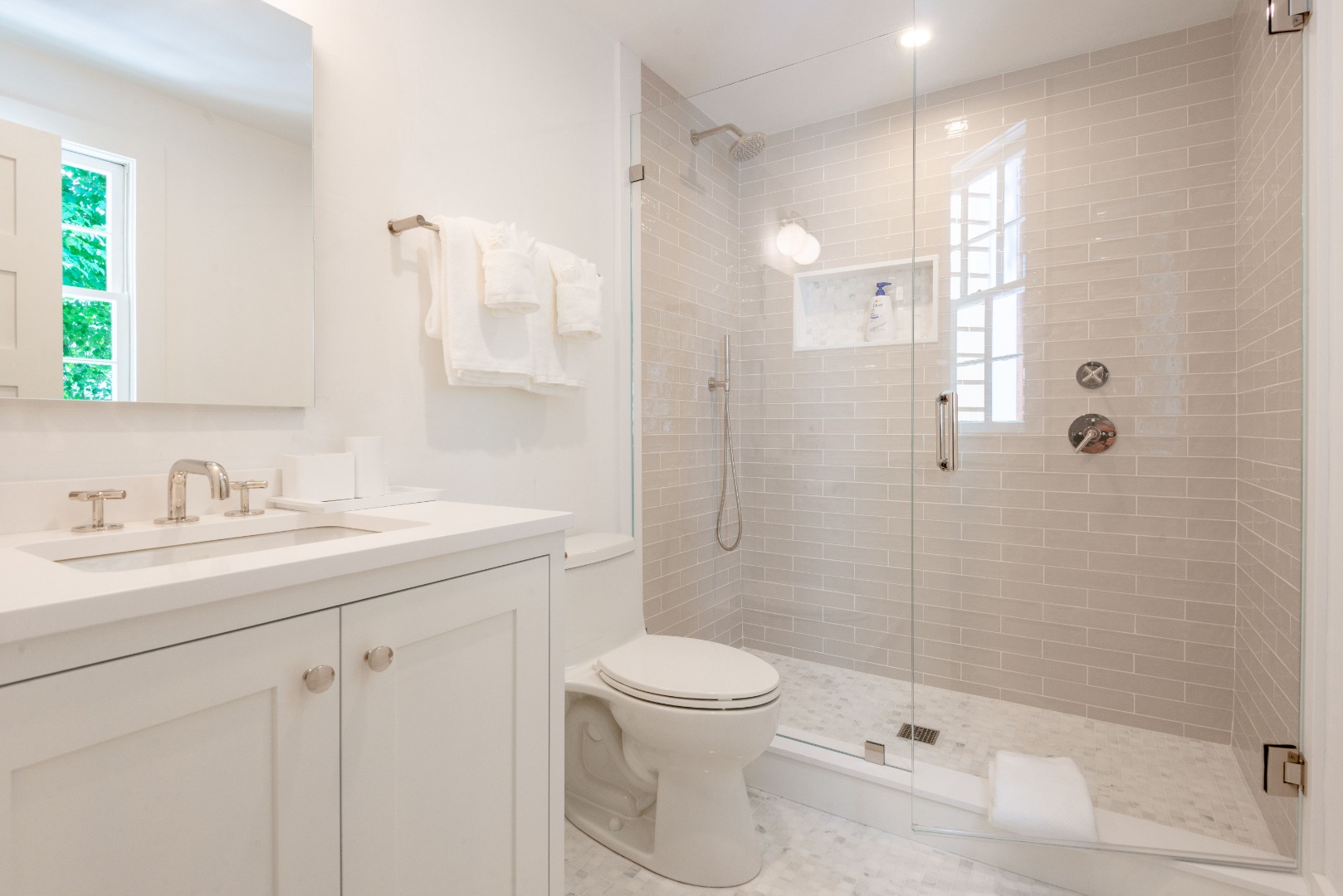 12 Willard Street Nantucket, MA 02554 - Photo 21 of 36 a bathroom with a sink toilet a mirror and shower
