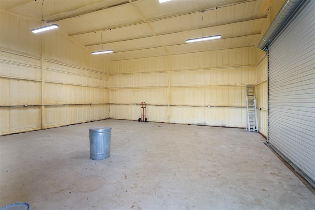 1019 Vaughan Lane Tioga, TX 76271 - Photo 6 of 40 Spacious warehouse interior featuring a concrete floor, high ceilings, and spray foam insulation on all walls and ceiling