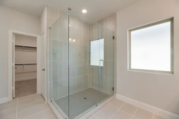 a bathroom with a shower and a sink