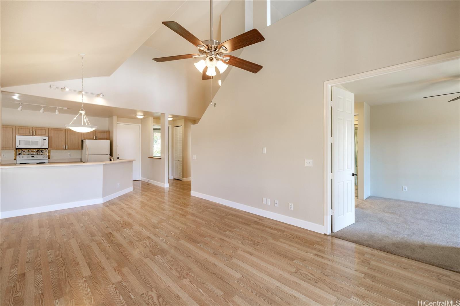 95-996 Wikao Street, Unit P304 Mililani, HI 96789 - Photo 1 of 1 an empty room with wooden floor and door