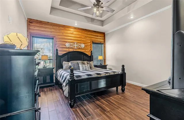 a bedroom with a bed and a dresser