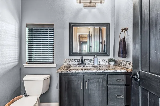 a bedroom with furniture and a book shelf