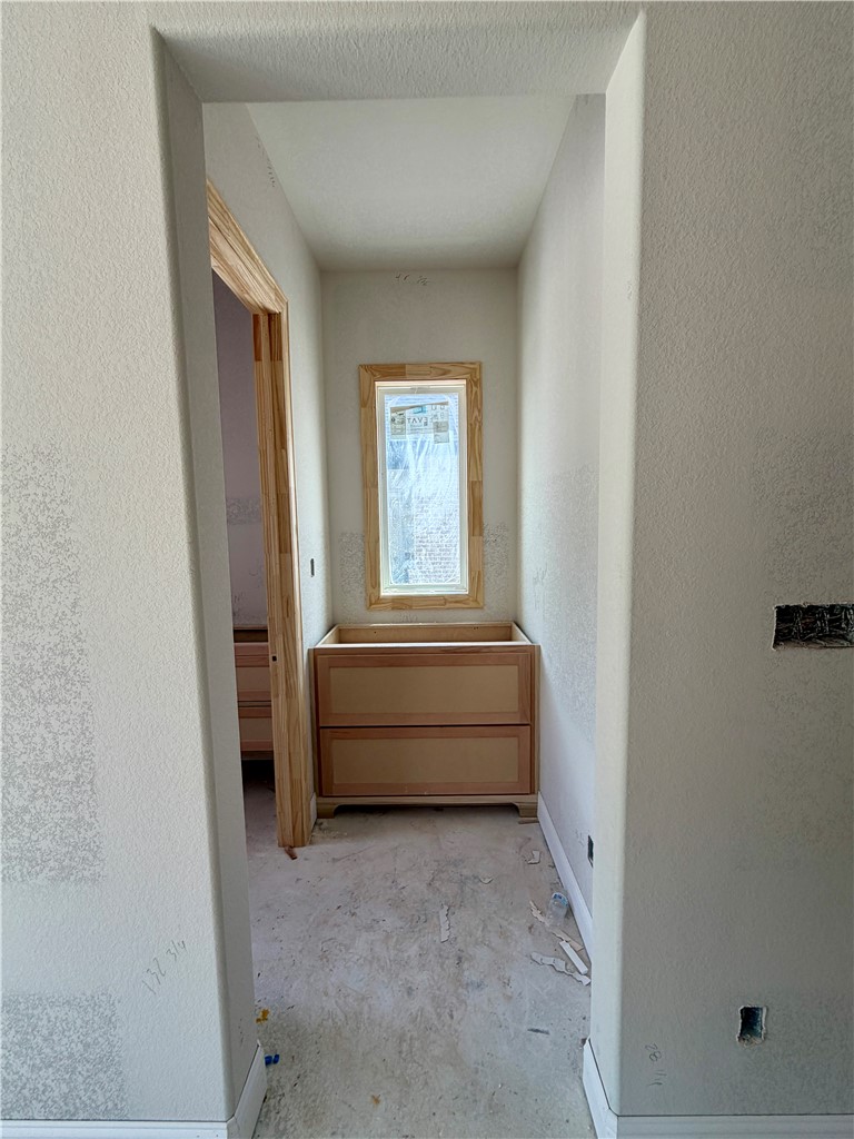 4024 Pacific Crest Way Bryan, TX 77802 - Photo 5 of 19 Hallway to pantry and half bathroom
