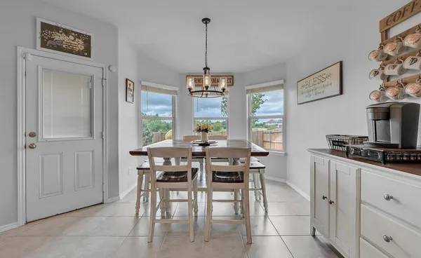 a view of a dining room with furniture window and outside view