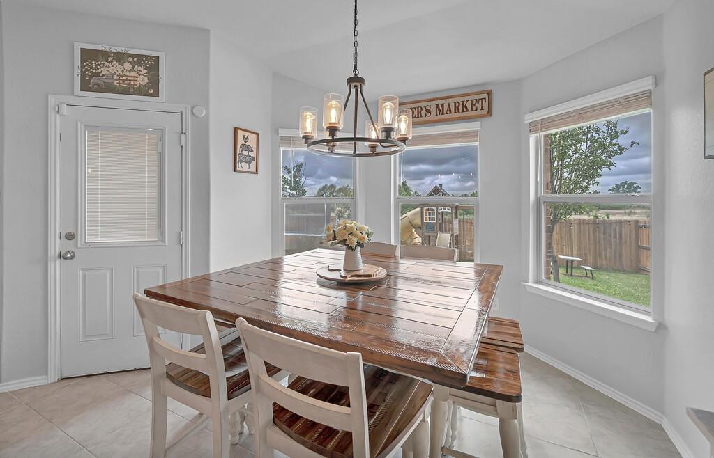 11108 Beckon Falls Waco, TX 76708 - Photo 15 of 32 a view of a dining room with furniture window and outside view