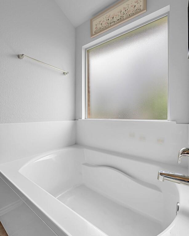 11108 Beckon Falls Waco, TX 76708 - Photo 21 of 32 a bathroom with a bathtub