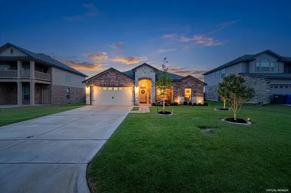 a front view of a house with a yard and trees