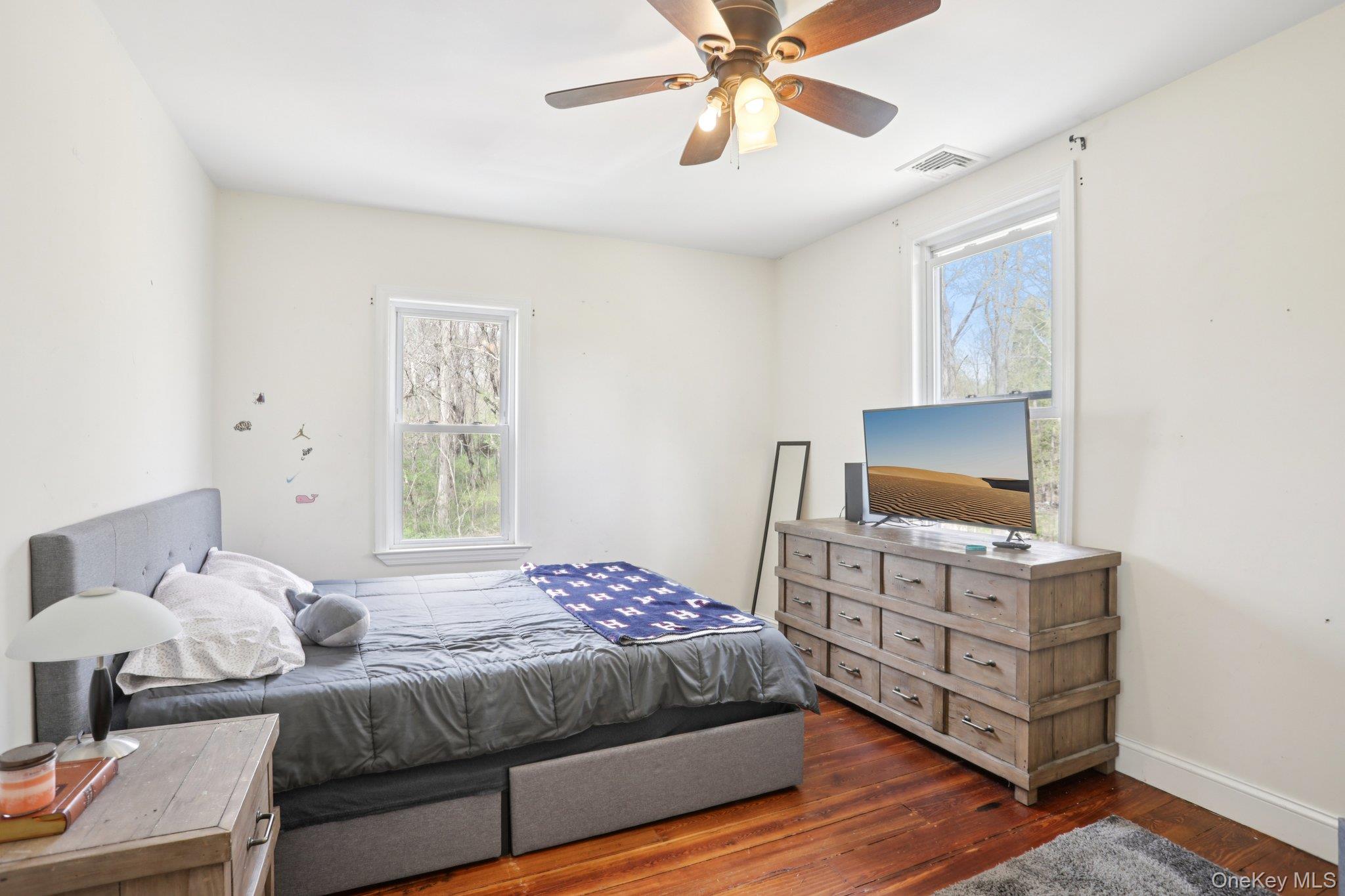101 Spring Valley Road Ossining, NY 10562 - Photo 24 of 39 a bedroom with a bed and a flat screen tv